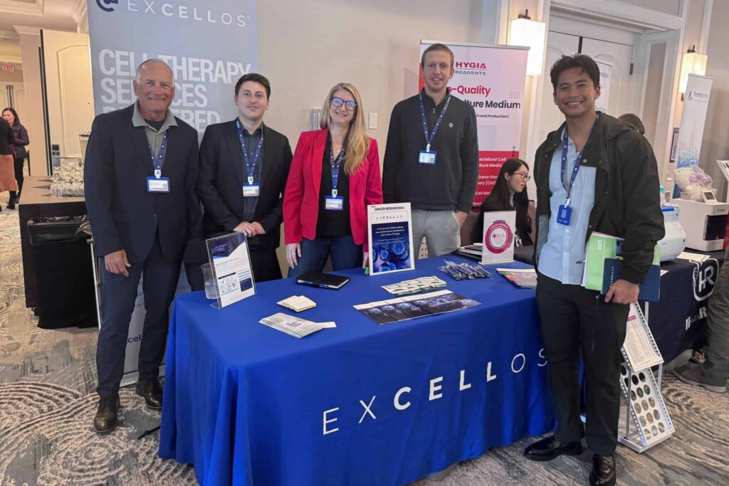 Excellos cell therapy services booth with whole team showcasing innovative therapies at gene therapy conference